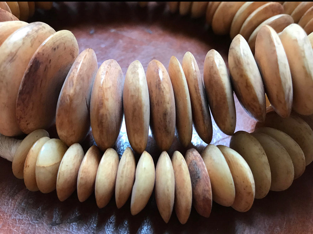 Strand of Camel Bone Disc Beads from Nigeria